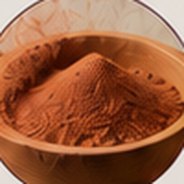 Ochre sand in a clay bowl.